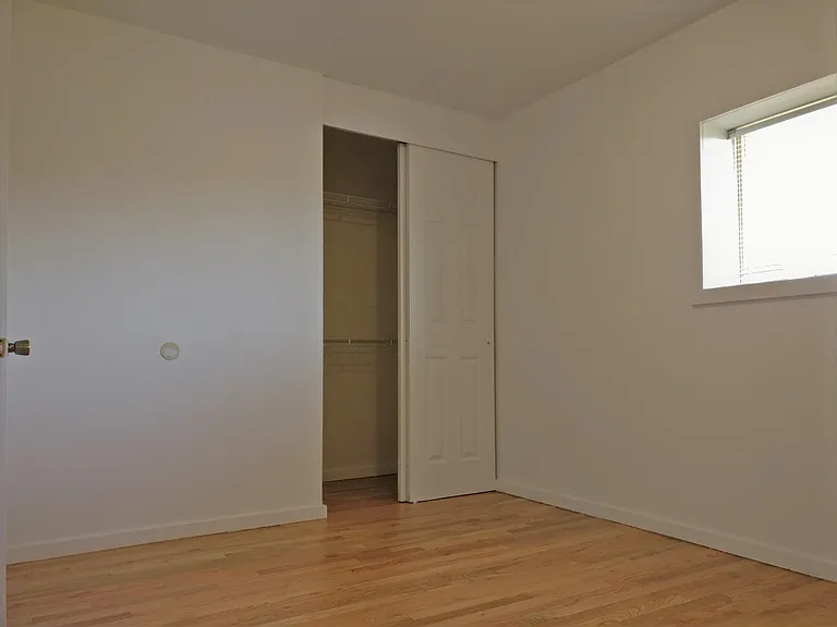 Hardwood floors with ample closet space in bedrooms