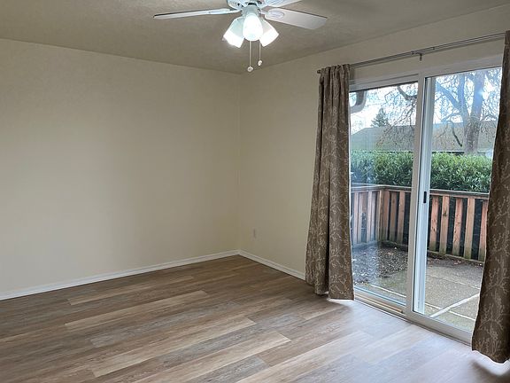 Dining room with patio door and ceiling fan
