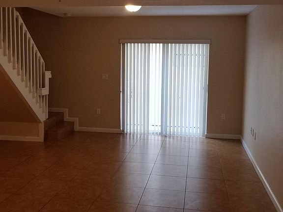 big living room with balcony view
