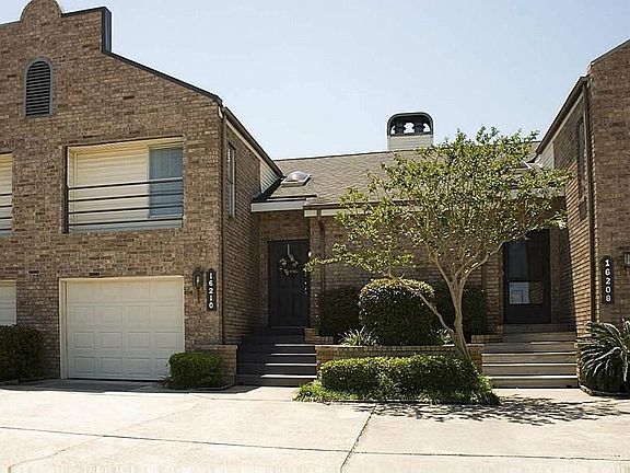 A garage for your vehicle and nice landscaping.