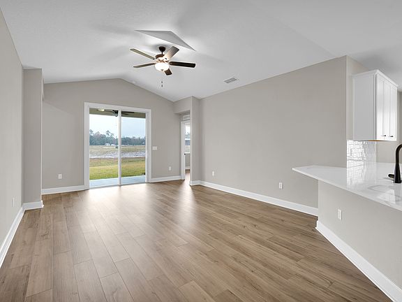 The family room brings in plenty natural lighting creating an open and welcoming space.
