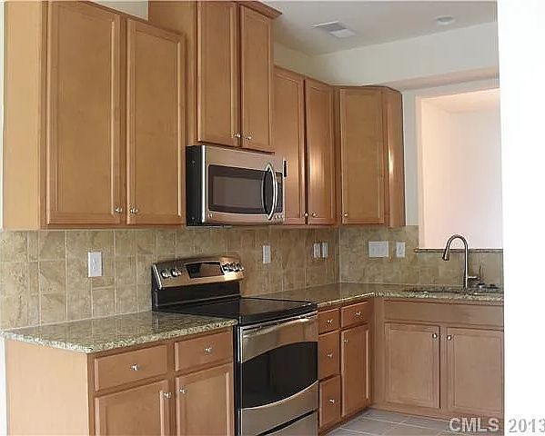 Kitchen with Microwave, Oven, Refrigerator and dish washer
