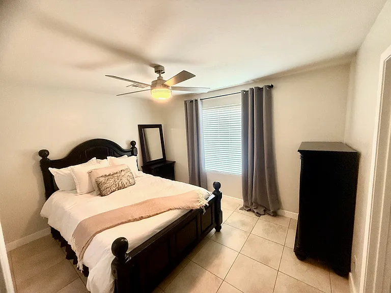 Queen Bedroom 2 with dresser, walk in closet, on-suite double sink bathroom