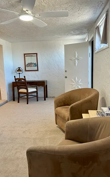 Bonus space with desk, sitting area and second exit to the street side of the condo