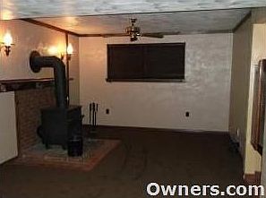 Gameroom with wood burner