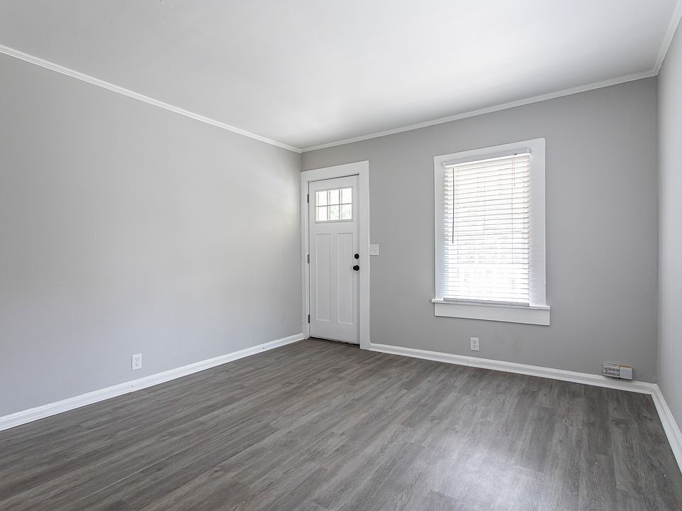 Bright and light front room with access to elevated front porch.