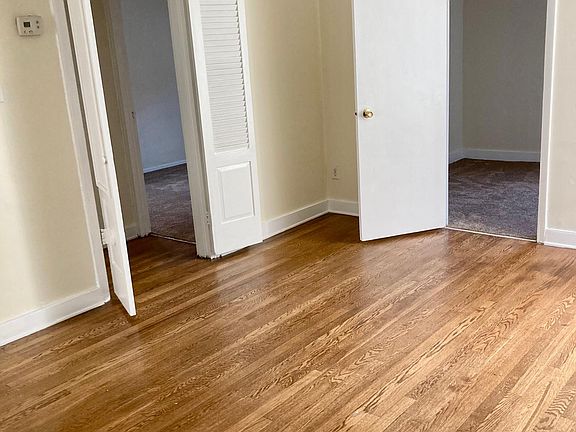 Livingroom area facing the entrance to the newly carpeted bedrooms