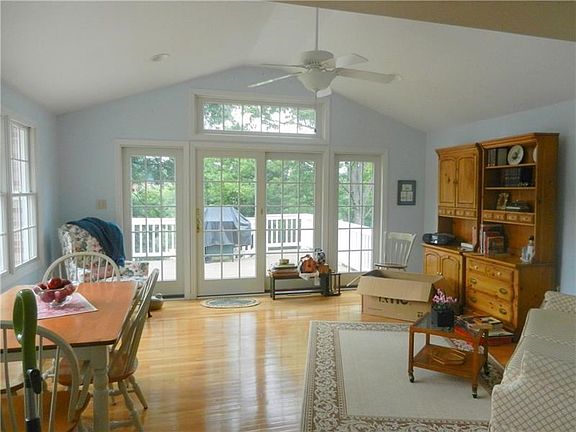 BRITE, CHEERY FAMILY ROOM WITH VAULTED CEILING, DOOR TO DECK AND CONVIENTLY LOCATED JUST OFF THE KITCHEN