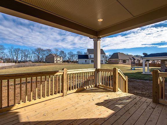 Enjoy the large, fully sodded yard and HOA common space from your covered deck