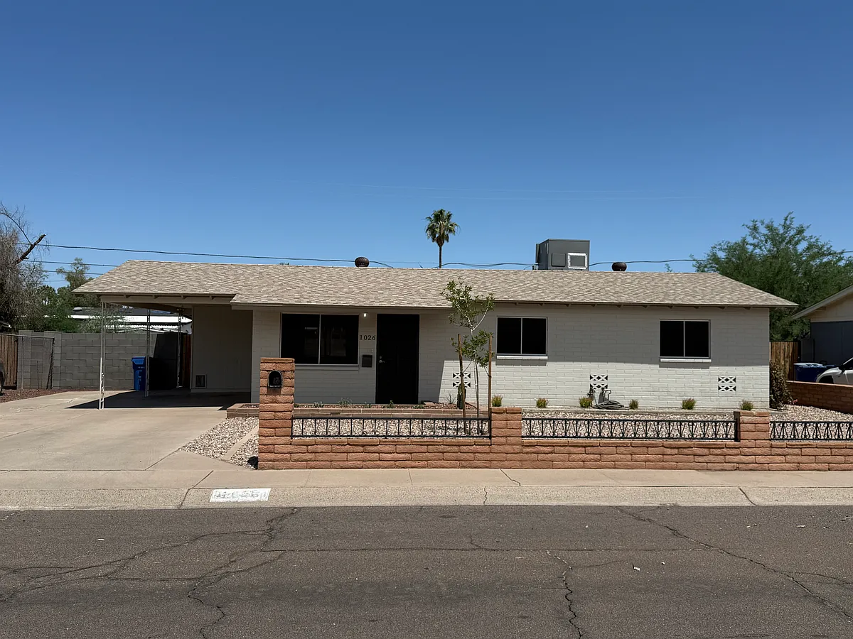 Exterior Front: front yard fencing. - 1026 W Romo Jones St
