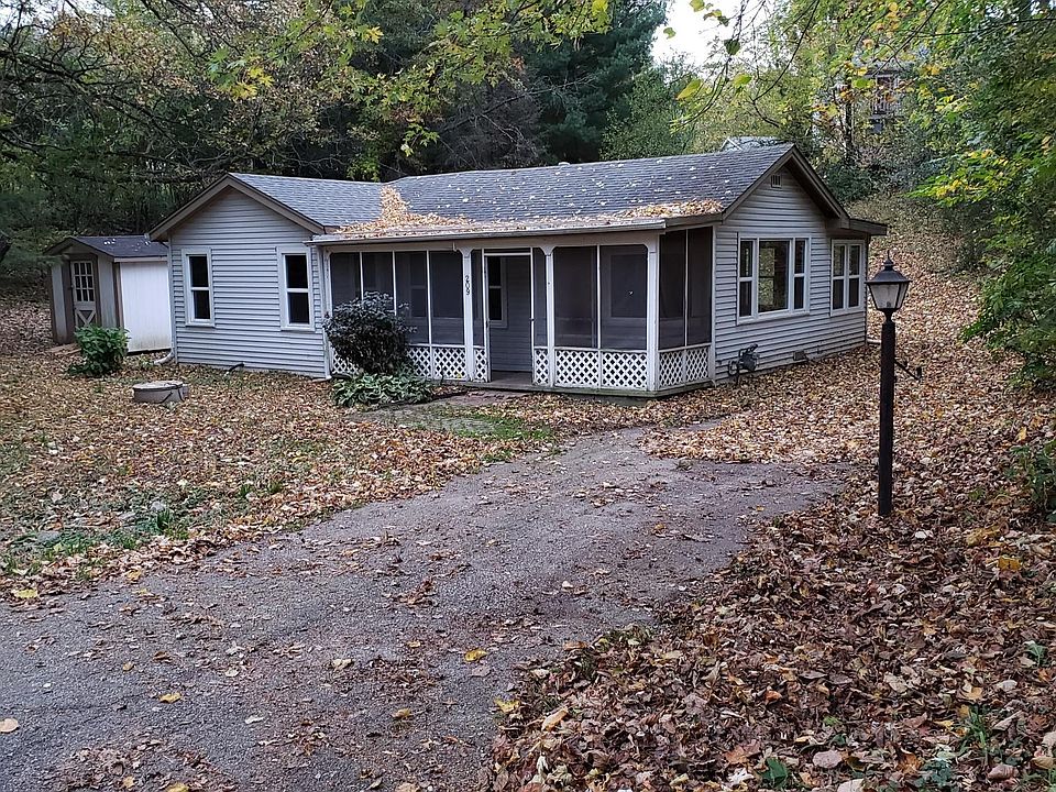 Front view of house Driveway parking with storage shed