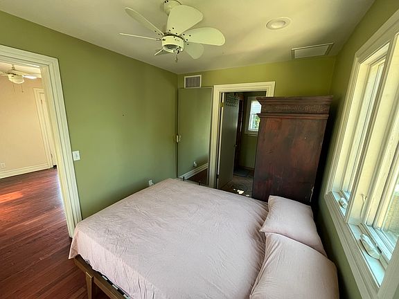 Bedroom - doors to main living area and bathroom.