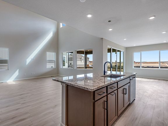 Gourmet kitchen overlooking great room and dining room