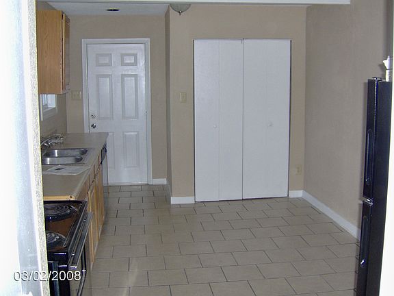 Eat in Kitchen with new Black Appliances and Tile