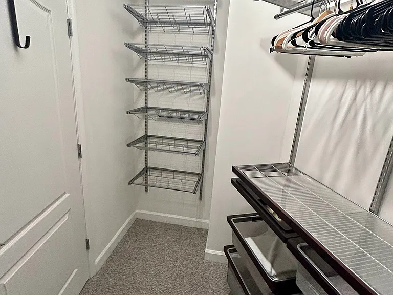 Massive walk-in closet with custom Elfa shelving.