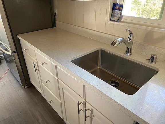 New big sink and faucet. Big stainless refrigerator w built in ice maker