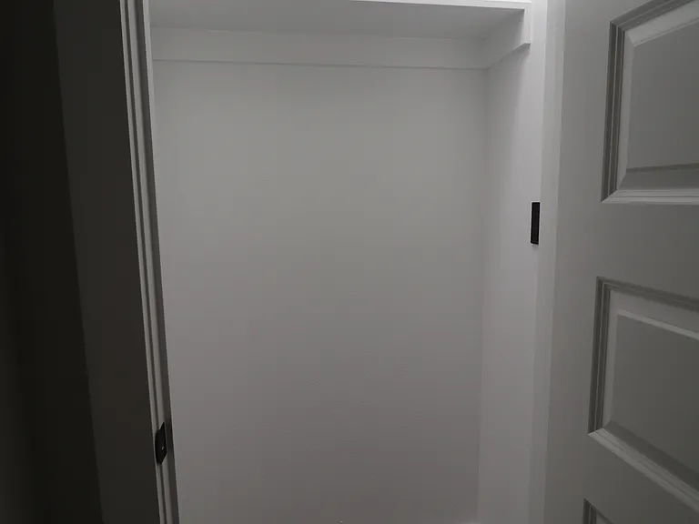 Convenient interior storage room offering extra space for household items and supplies.