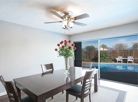 View of your spacious backyard with private swimming pool from the formal dining room. ** To Virtual