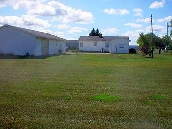 Back view of garage and home