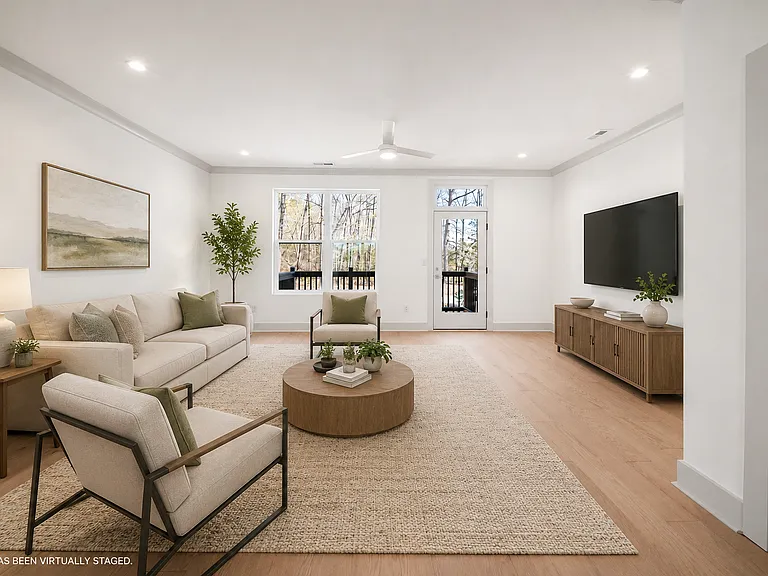 Beautiful sun soaked living room with access to a back deck