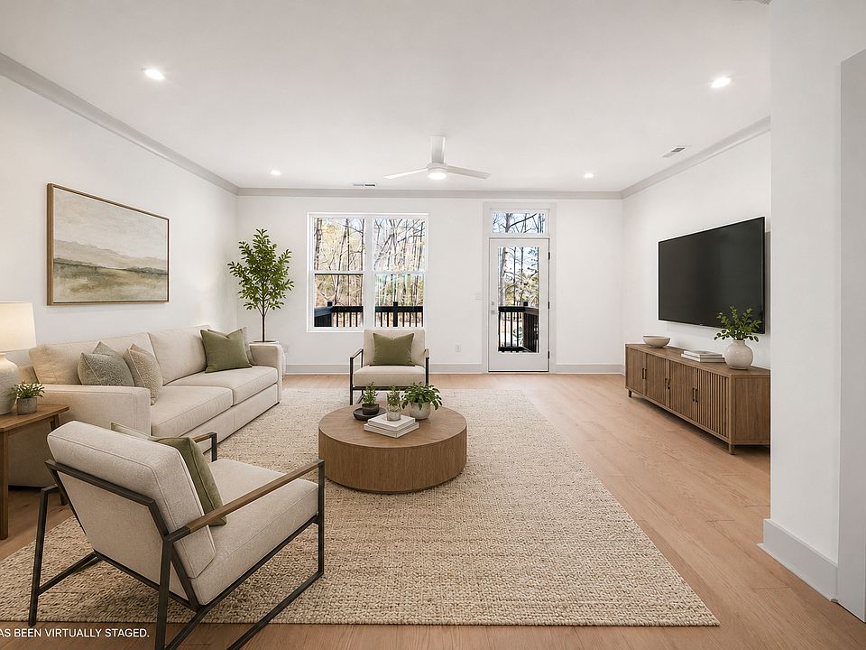 Beautiful sun soaked living room with access to a back deck