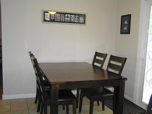 Great informal dining room space with door leading to the spacious backyard and deck