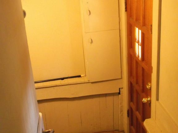 Side door entrance , stairs to basement