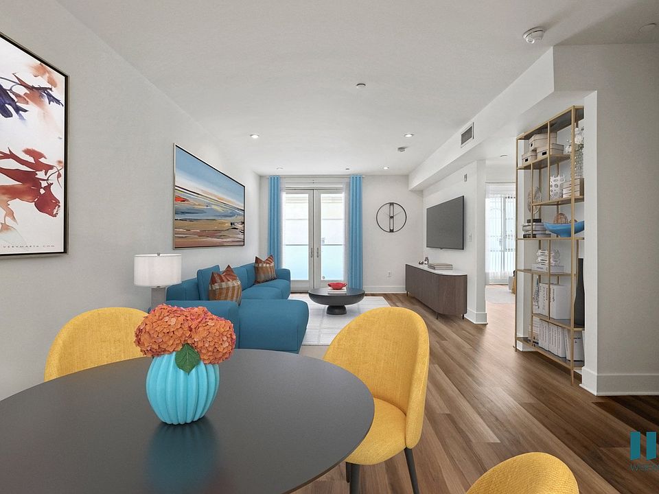 Open-Concept Dining and Living Room with Patio