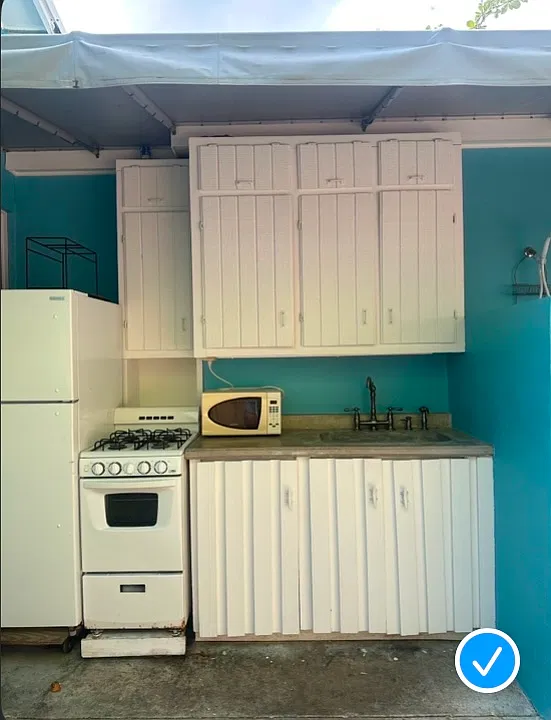 Closeup of outdoor kitchen. The refrigerator and microwave in this pic have been replaced with new ones.