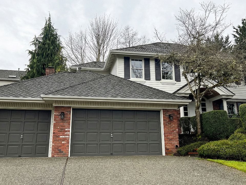 In a quiet cu-de-sac, this lakemont house has an Impressive 3-car garage and grand covered entry featuring brick accents, privacy landscaping, and a stunning vaulted wood-lined porch.