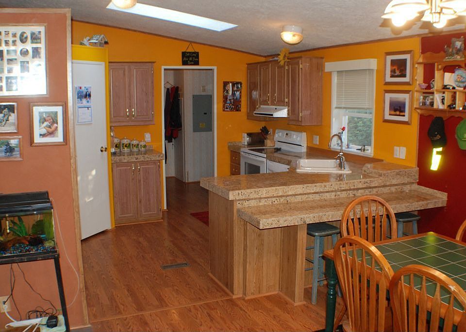 Remodeled Kitchen with Granite tile countertops