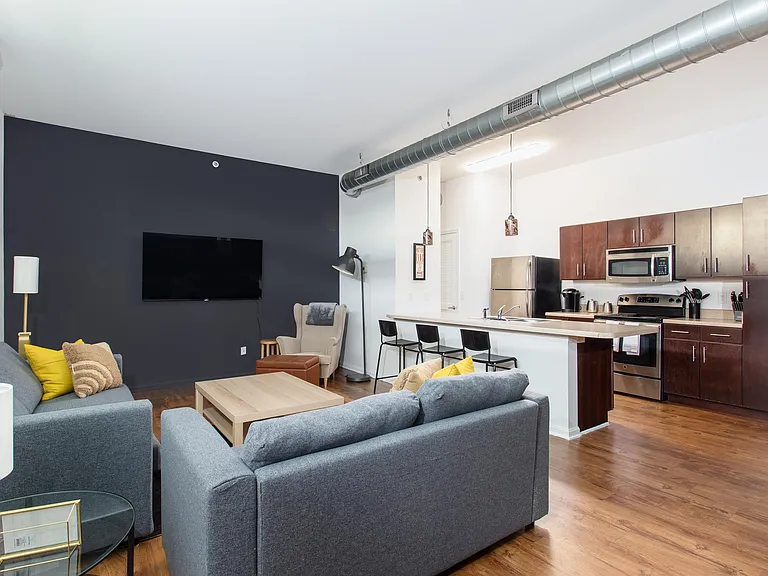 Wood look Vinyl Plank flooring throughout unit except in bedrooms where you get carpet...