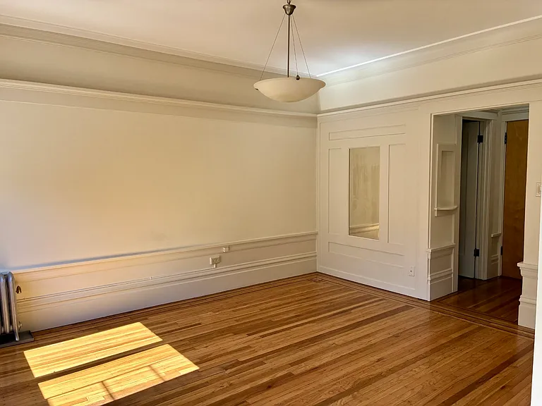 Sunny living space with classic molding