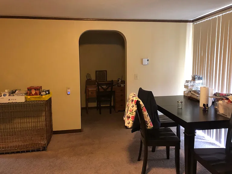 Dining room with entry to spacious hall and to the right bedroom #2; older picture not showing new flooring in the dining room