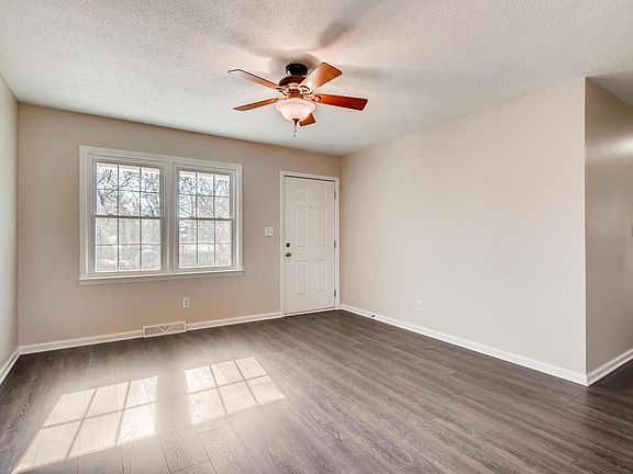 Newer Laminate vinyl plank flooring in most room. Ceiling fan/light in the family room.
