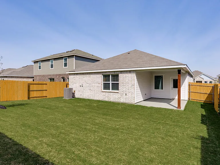 The back yard is fully fenced in.