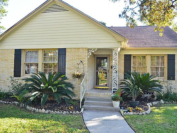The beautiful bungalow features great curb appeal with fabulous landscaping and a front porch entry.