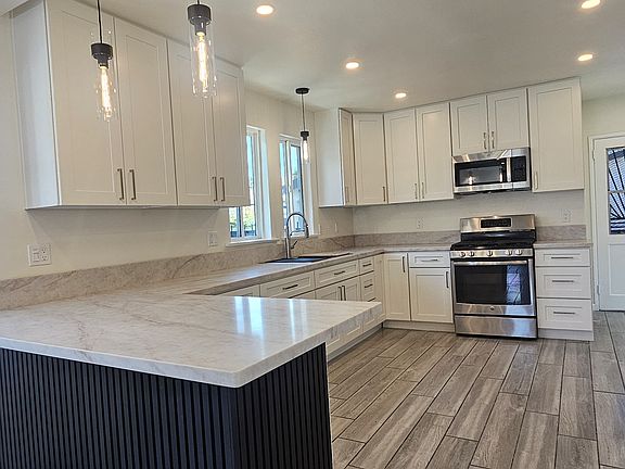 Remodeled kitchen with recess lighting