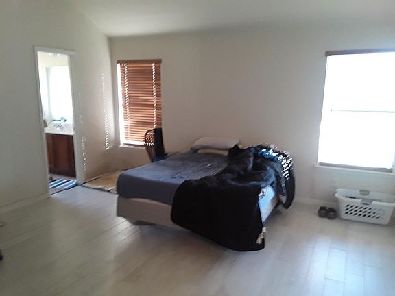 Master Bedroom - White washed tile floors - ceiling fan