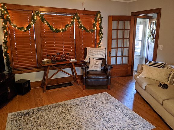 A different perspective of livingroom looking towards front door. Plenty of windows!