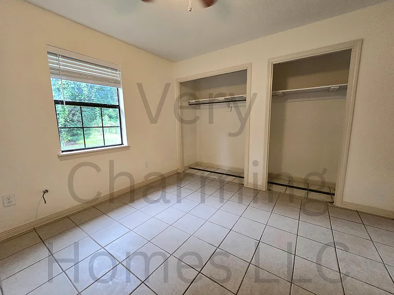 The rear bedroom is large and has two closets.