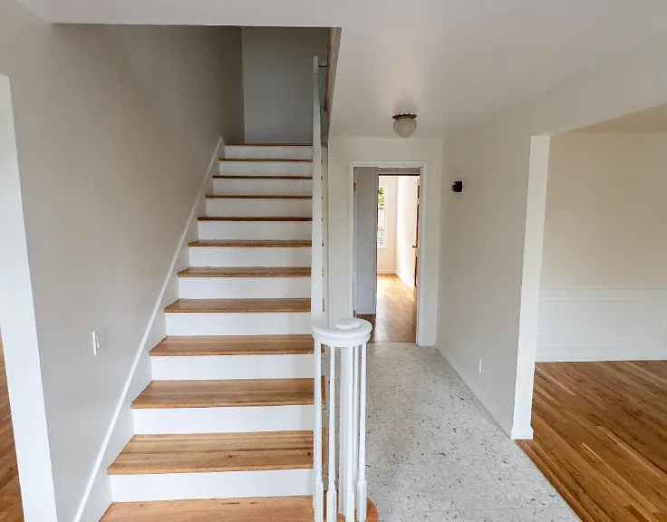 stairs to the second floor by front door