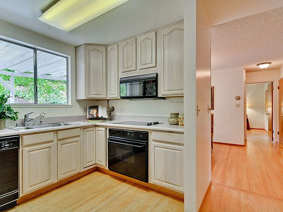 Plenty of Cabinets & View to Back Yard