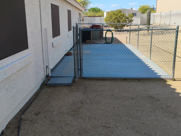 Private shady fenced dog run. Shady eastern side of the house.