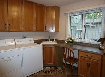 Very spacious main floor laundry also has hickory cabinets!