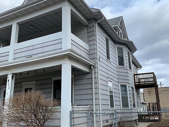 Side view of deck off kitchen. Partially fenced yard