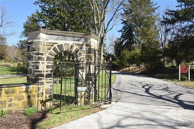 Enter Valeria thru these stone pillars and iron gates for a gracious entrance into the complex
