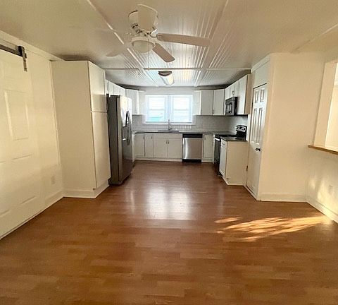 Pantry closet and plenty of dining area as part of this large kitchen.
