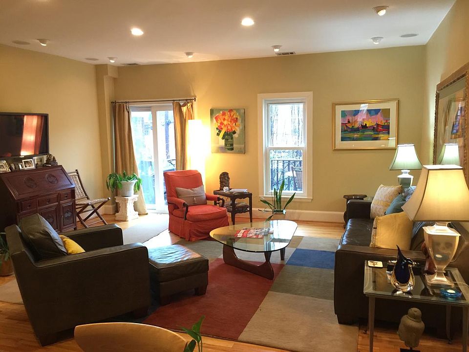 Open living room space that leads to a spacious teak deck.