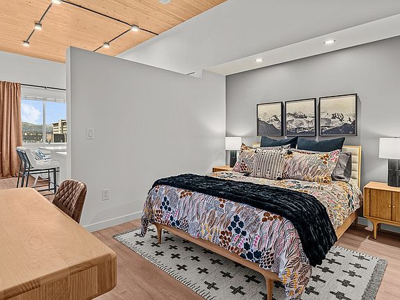 Experience contemporary comfort in this beautifully designed bedroom, merging style and serenity.